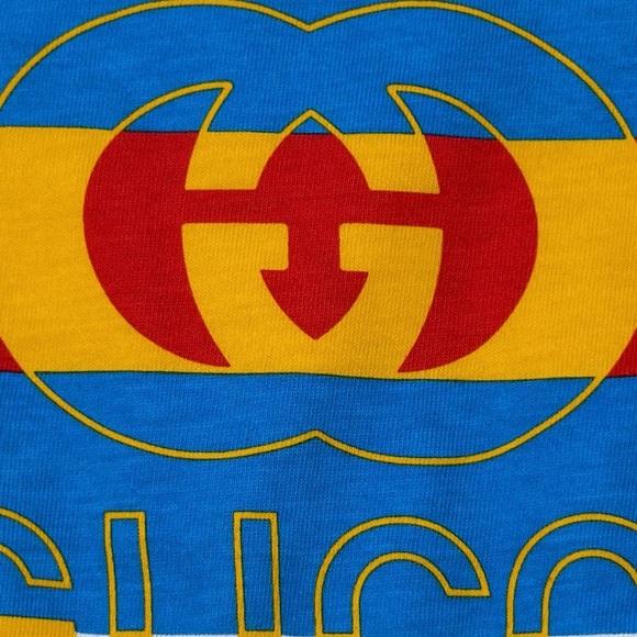 Gucci Kids' White Bib, Onesie And Beanie Set with Blue, Red, and Yellow Accents - Picture 7 of 7